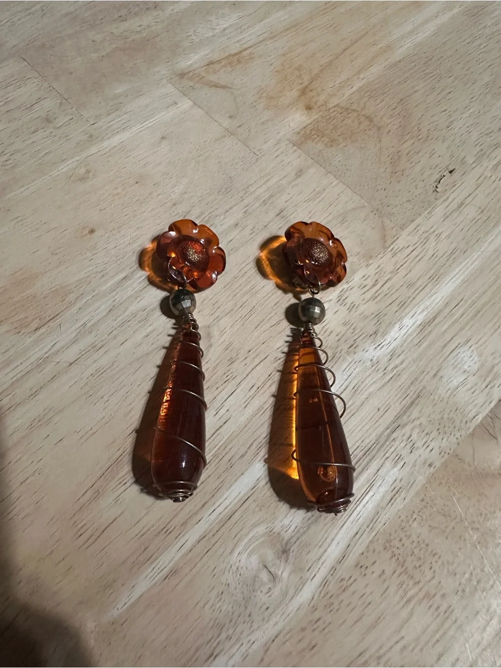 1990s amber Lucite flower and wire-wrapped teardrop dangle clip-on earrings